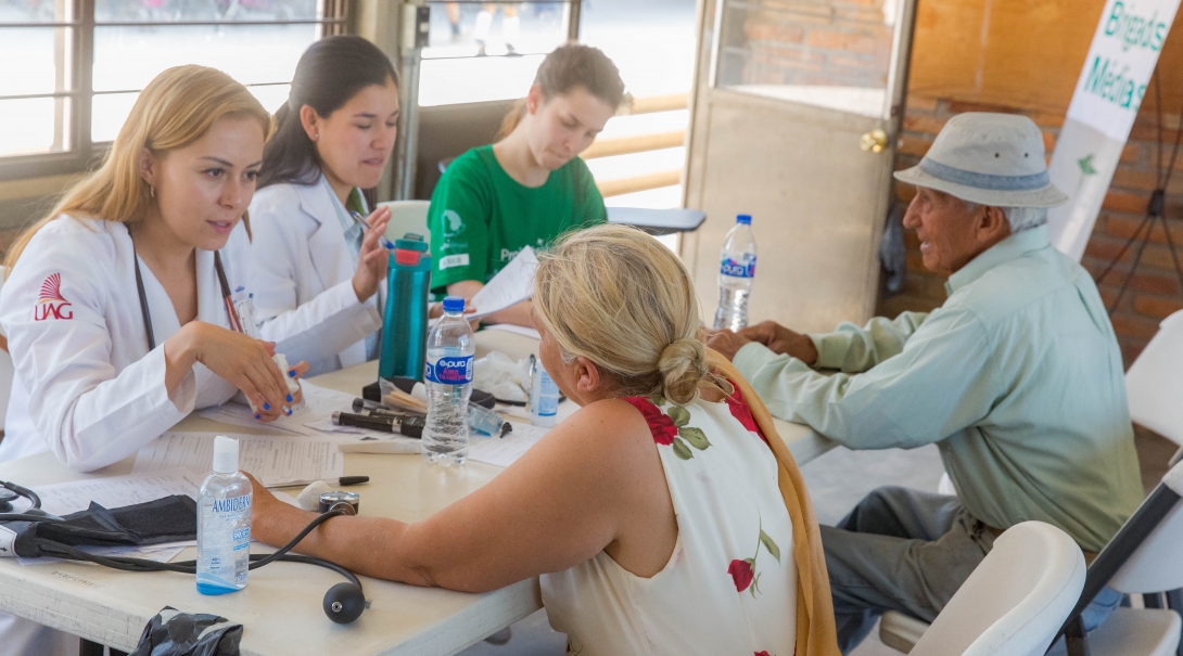Projects Abroad interns do blood pressure checks at their Public Health placement in Mexico for groups. Interns measure blood pressure as part of their public health work in Mexico with a group.